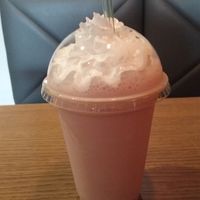 This is a small morello cherry milkshake- with whipped cream, absolutly divine!! they serve freshly squeezed lemonade, handmade soda and coke too! at Earth Restaurant & Takeaway in Petersfield