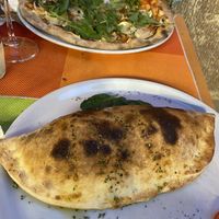 Vegan Pizza with Rocket salad and the calzone with mincemeat  at Sa Cova in Mallorca