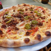 Vegan Diavola pizza (seitan salami, onions, red pepper, jalapeños) at Sa Cova in Mallorca