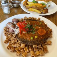 Mains - in the rapid fire Spanish explanation I missed what the dish in front was called, looks similar to silpancho but with pasta instead of rice?  at Lupito Cocina Vegana in La Paz