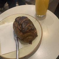 Pain au chocolat and orange juice  at Arapina in South East London