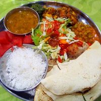 Mix of 3 dishes, salad, breads and rice at Cantina Indiana in Lisbon
