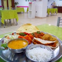 Mix of dishes, salad and bread without butter at Cantina Indiana in Lisbon
