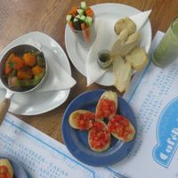 Bruschetta, roasted root vegetables, crudité, mint& pineapple fresh juice. at Bohemia Cafe in Havana