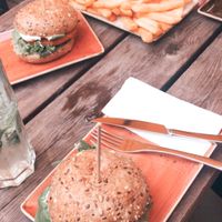 ‘Chicken’ style vegan burger on the left, 1 pound fries with two vegan mayo’s at the top  at Peter Pane - Hoheluftchaussee in Hamburg