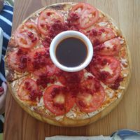 Mexican Pizza with a side of chili oil at Macai in Puerto Vallarta