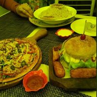 Pizza, burger with fish fingers( didn't taste like seafood ,but it is worth trying!) . Pasta was pretty good with mild flavours at Rare Earth Cafe & Organic Store in Mumbai