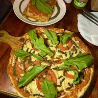 Riquísima lasaña y pizza con queso vegano  at Pepperland Bar in Santiago