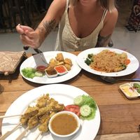Satay sticks, tofu bites and wide noodle stir fry   at Yo Vegan in Phuket