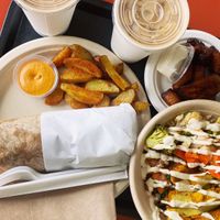 Burrito and bowl combo plate with tofu, roasted veggies and vegan cream. YUM!   at Oasis Vegetarian Cafe in Riverside