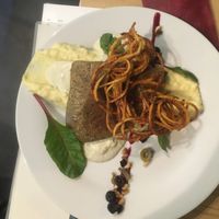 seitan steak with potatoe chips and mashed potatoes at Die Küche in Brno