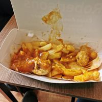 Sausage, chips and curry sauce at Robertson's Chips Away in Whitby