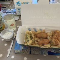 Pea fritter, nuggets, battered sausage and chips. Garlic mayo on left along with Aldi vegan lemon cider!  at Robertson's Chips Away in Whitby