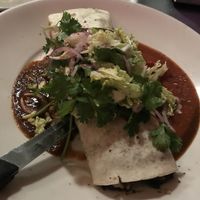 huge burrito the size of my head! called the burrito de evan. with mushrooms, vegan cheese, and skip the sour cream at Cafe Miranda in Rockland