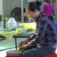 Owner making spring rolls at Com Chay in Chon Thanh