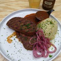Homemade quinoa tempeh steak, gravy, mashed potatoes and pickled onions at Knol & Kool Bistro & Superet in Ghent