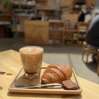 Iced coffee and croissant  at Knol & Kool Bistro & Superet in Ghent