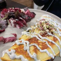 Amazing omelette filled with spinach and mushrooms with a dill dressing  at Retreat Kitchen in Richmond Upon Thames