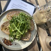 Smashed avocado & rocket on sour dough - vegan   at Retreat Kitchen in Richmond Upon Thames