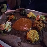 Two curries on homemade Ethiopian flatbread at Naomi Restaurant & Bar in Bergen