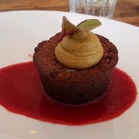 Chocolate cake with pistachio cream and red fruit coulis at Hope in Paris