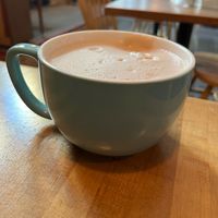 Chai latte with almond milk in ceramic mug at Rock Hill Bakehouse Cafe in Glens Falls
