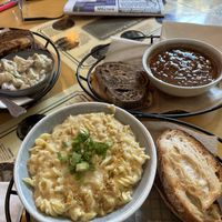 Reuben sandwich with potato salad, mac & cheese, with garlic bread, cheese, chili, and beans  at Rock Hill Bakehouse Cafe in Glens Falls