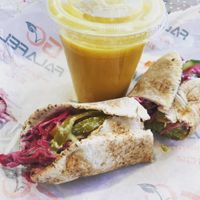Fully loaded wrap with a mango smoothie side  at Go Falafel - Deansgate in Manchester