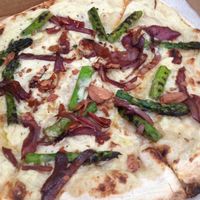 vegan pizza special with asparagus, caramelized onion, and almond skin 'bacon' with cashew bechamel base at Pompieri Pizza in Durham