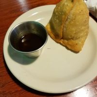 This was just ONE of the two huge veggie samosas that came with the appetizer. So filling and delicious; filled with carrot, peas, and shredded potato. Love carbs for life. at Cumin Indian Cuisine in Kalamazoo