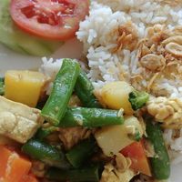 I didn't get any good overview shot, so here's 3 slightly-blurry images that might tell the story.

(Tofu+tempe curry plus watermelon juice) at Memoh Warung in Canggu
