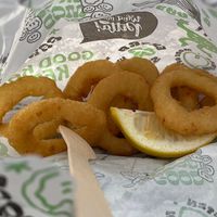 Friend onion rings with a splash of lemon. Can’t beat it    at What The Pitta in Croydon