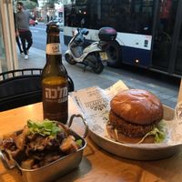 Schnitzel burger and home fries at Goodness in Tel Aviv