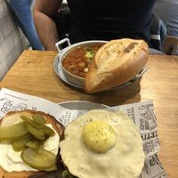 Shakshuka and cheeseburger with fried egg at Goodness in Tel Aviv