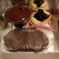 Profiterole (left), tart with patisserie and black cherry (right), walnut filled chocolate, aka "karioka" in greek (front) at Pasalidis in Thessaloniki