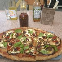 vegan pizza, chili oil and drinks at Organic Pizza in Salzburg