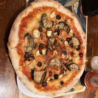 Organic (!) Pizza with vegan Mozzarella, artichokes, zucchini, nuts, herbs and basil   at Organic Pizza in Salzburg
