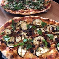 Vegan special pizza and vegan pizza #2 at Organic Pizza in Salzburg