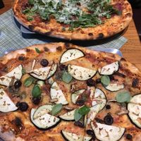Amazing vegan pizza with vegan cheese and eggplant. Delicious crispy thin, wood-fired crust! at Organic Pizza in Salzburg