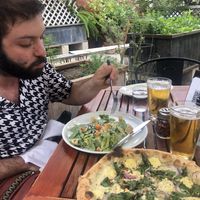 Caesar salad and thunder kiss pizza at Donna Jean in San Diego