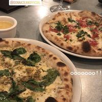 Pizza, crust dipping sauce, and wine! So good   at Donna Jean in San Diego