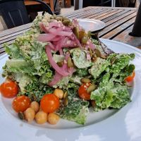 Salad Days: mixed greens, hemp seed miso dressing, apples, chickpeas, pickled onions, toasted pumpkin seeds, smoked date and black garlic puree (oil-free) at Donna Jean in San Diego