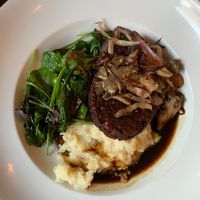 Salisbury Tempeh with potatoes and salad at Donna Jean in San Diego