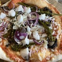 Pizza with vegan feta & veg. Personally not a fan of the broccoli   at The Stable in Newquay