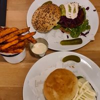 In front the vegetarian burger, sweet potato fries with aioli and behind the vegan burger at Ludwig Burger in Salzburg