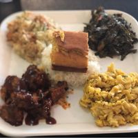 Popping BBQ with rice, potato salad, collars and Mac and cheese with a side of cornbread. Delicious  at Soul Good Vegan Cafe in Durham