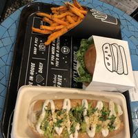 Sweet potato fries, original burger, and pesto meatball sub. SO GOOD.  at By Chloe - Seaport Blvd in Boston