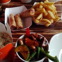 Chili and cashew nuts straight for the wok, rice, fries, vegetable spring rolls. at LANA in Galway