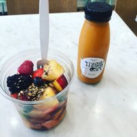 Fruit bowl, carrot juice  at Maisie Cafe in Paris