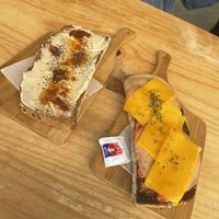 toasts hummus/dried tomato and tomato/vegan cheese/vegan mortadella (1.8€ each)  at Mimimi in Granada